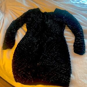 Black long sleeve mini dress with sequins. Worn once for a few hours.